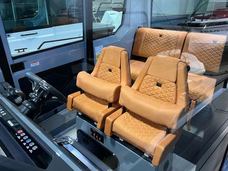 Slide: The Image of Luxurious interior of 2022 BRABUS Shadow 500 Cabin with tan leather seating. - 34