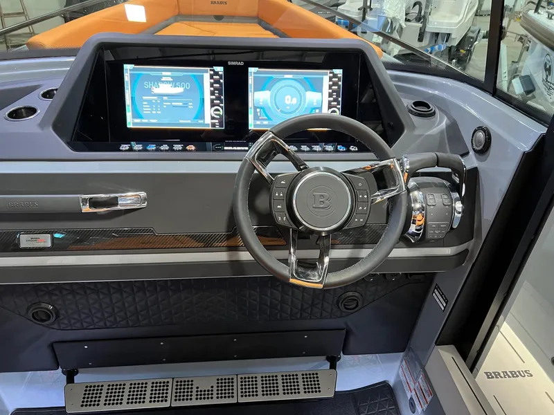 Slide: The Image of 2022 BRABUS Shadow 500 Cabin dashboard with modern steering and dual digital displays. - 36
