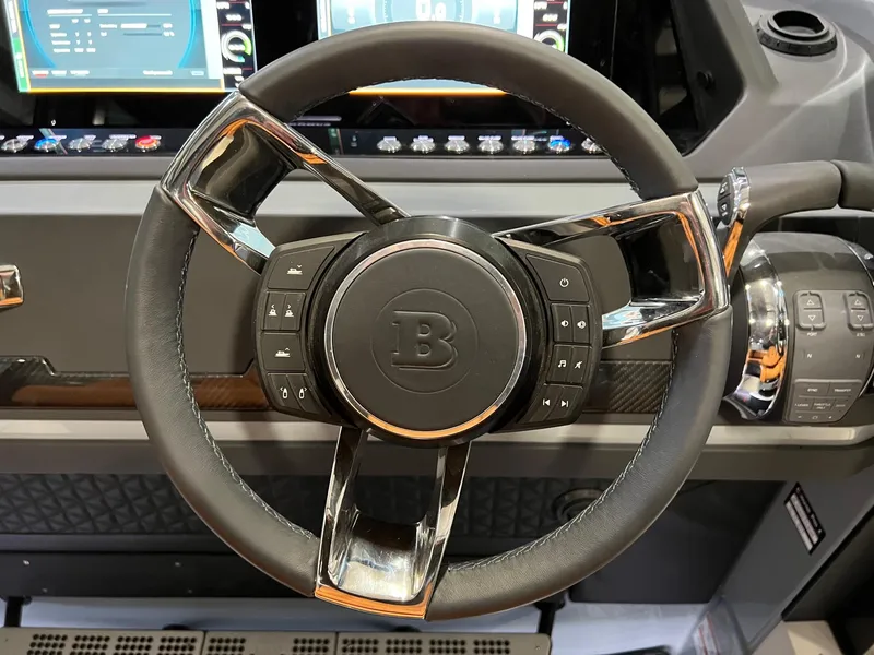 Slide: The Image of Steering wheel of 2022 BRABUS Shadow 500 Cabin with control buttons and sleek design. - 37