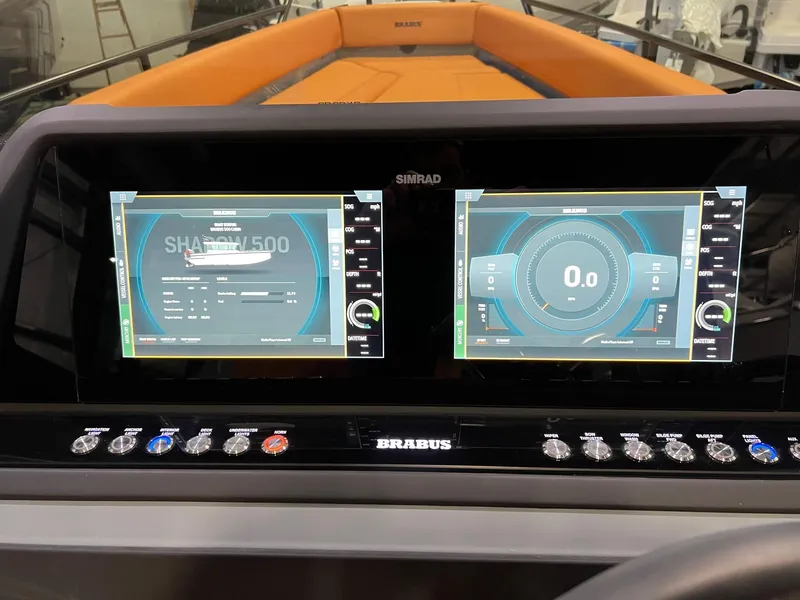Slide: The Image of 2022 BRABUS Shadow 500 Cabin dashboard with dual digital displays and control panel. - 38