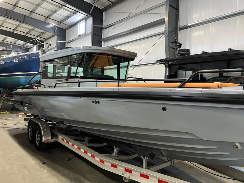 Slide: The Image of 2022 BRABUS Shadow 500 Cabin boat on trailer in indoor storage. - 4