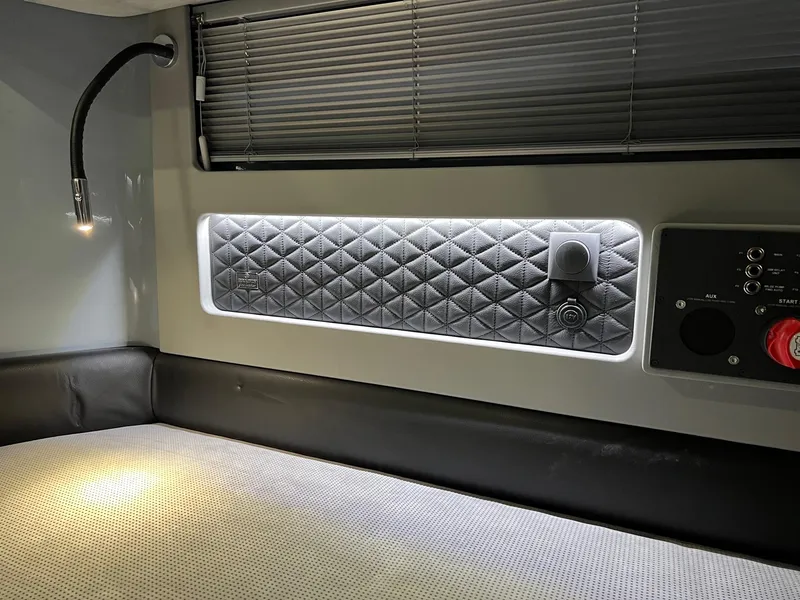 Slide: The Image of 2022 BRABUS Shadow 500 Cabin interior with quilted panel, reading light, and control panel. - 47