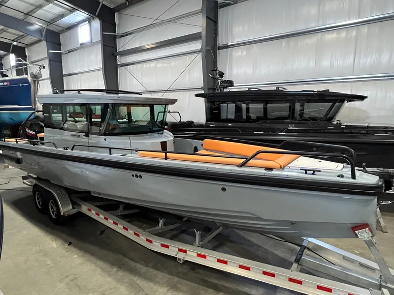 Slide: The Image of 2022 BRABUS Shadow 500 Cabin boat on trailer in indoor storage facility. - 6