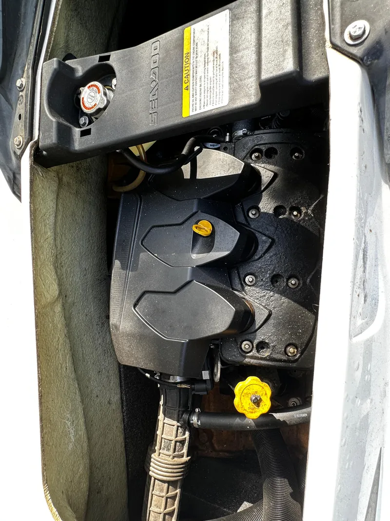 Slide: The Image of Engine compartment of a 2012 Sea-Doo GTX 155 watercraft, showcasing internal components. - 10