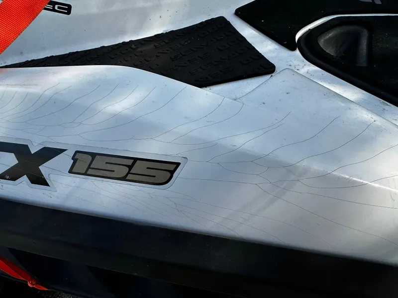 Slide: The Image of 2012 Sea-Doo GTX 155 close-up showing model branding and surface details. - 4