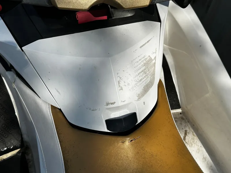 Slide: The Image of 2012 Sea-Doo GTX 155 jet ski, white and gold, close-up view of seat and console. - 6