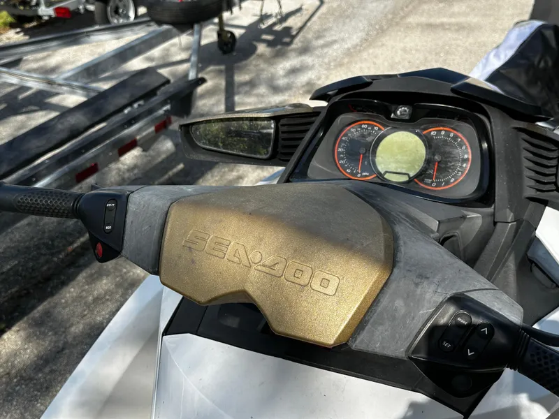 Slide: The Image of 2012 Sea-Doo GTX 155 dashboard and controls, featuring speedometer and handlebar. - 7