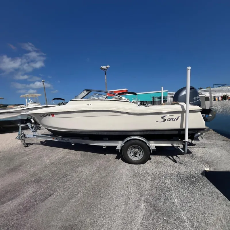 The Image of 2018 Scout 210 Dorado boat on trailer under clear blue sky at Boateka in Merritt Island, Florida. - 0