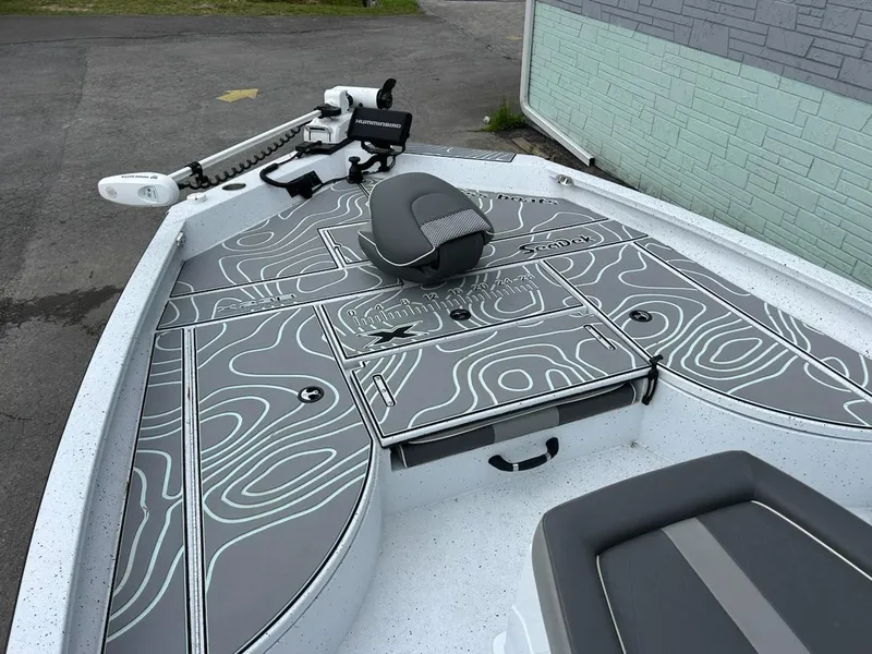 Slide: The Image of 2024 Express X23 Bay Lounge boat with stylish deck design and seating. - 8