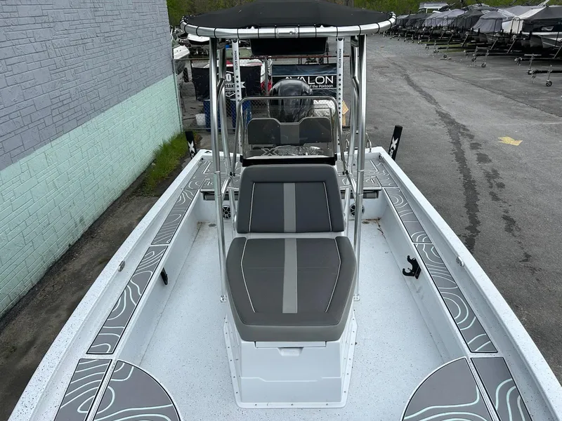 Slide: The Image of 2024 Express X23 Bay Lounge boat with sleek seating and modern design. - 9