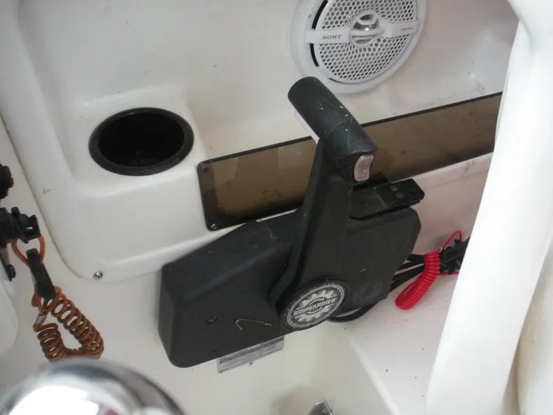 Slide: The Image of 1998 Boston Whaler 23 Conquest boat throttle control and speaker detail. - 9