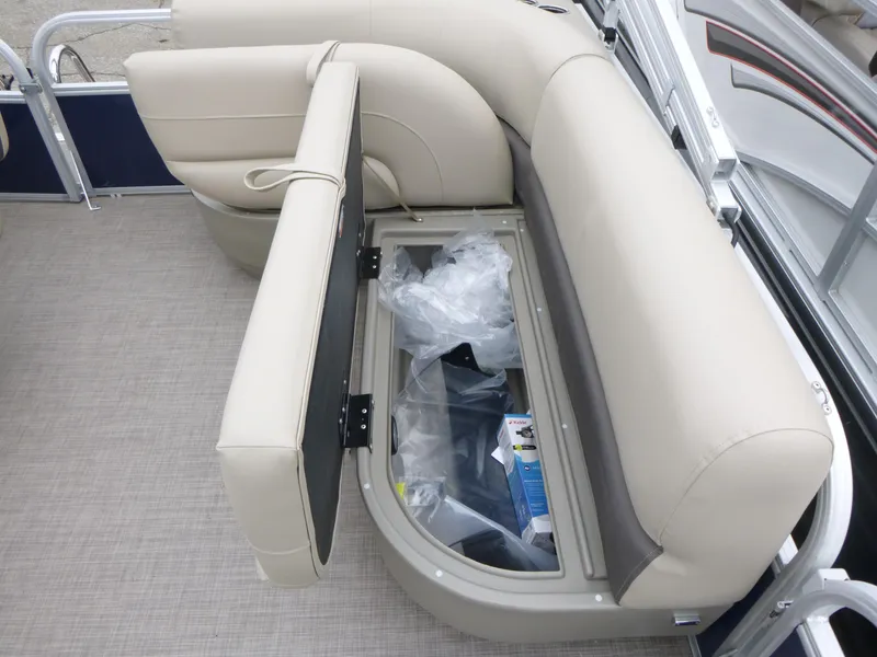 Slide: The Image of 2025 Sun Tracker Bass Buggy 16 XL Select boat seat with open storage compartment. - 7