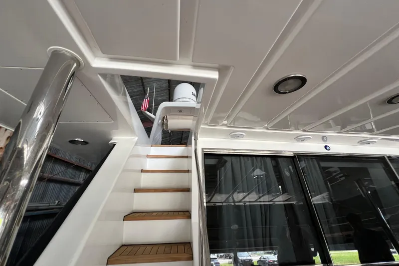 Slide: The Image of Staircase on a 2001 Falcon 106 yacht with sleek interior design. - 11