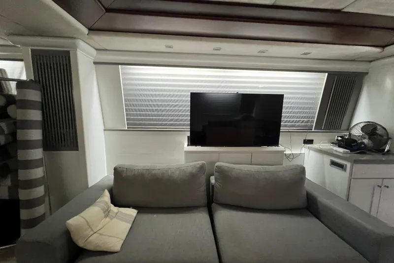Slide: The Image of Luxurious interior of a 2001 Falcon 106 yacht with modern decor and entertainment setup. - 20