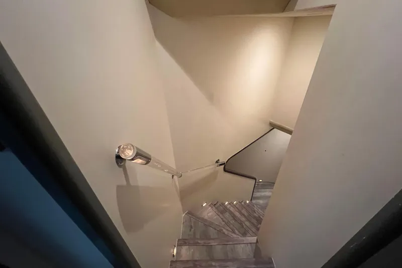 Slide: The Image of Modern spiral staircase with sleek handrail, inside a Falcon 106 yacht, 2001 model. - 22