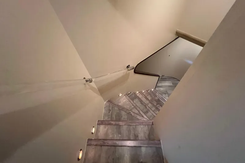 Slide: The Image of Modern staircase with wooden steps and glass railing, Falcon 106 yacht, 2001 model. - 23