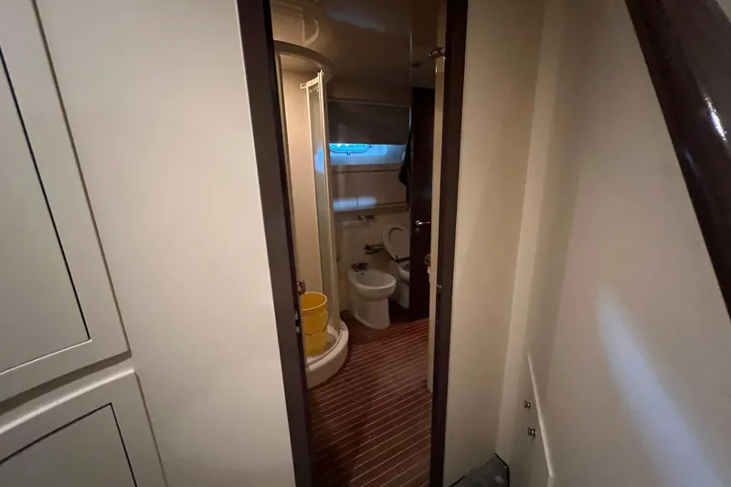 Slide: The Image of Bathroom interior of 2001 Falcon 106 yacht with shower and toilet. - 27
