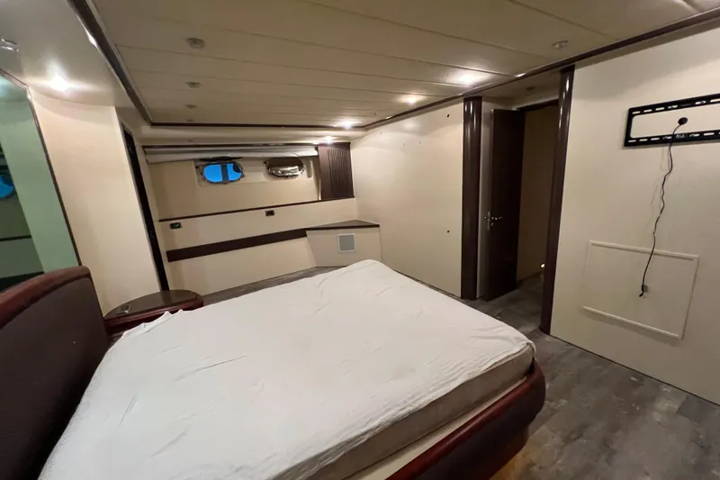 Slide: The Image of Luxurious bedroom interior of 2001 Falcon 106 yacht with modern design elements. - 37