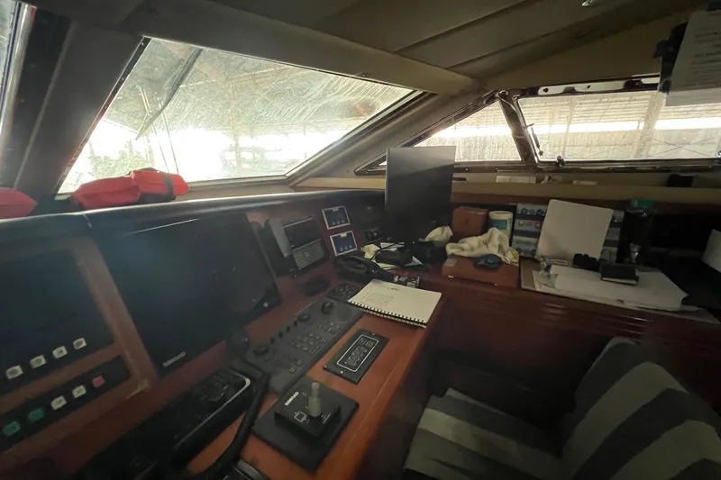 Slide: The Image of Cockpit of 2001 Falcon 106 yacht with navigation equipment and control panels. - 47