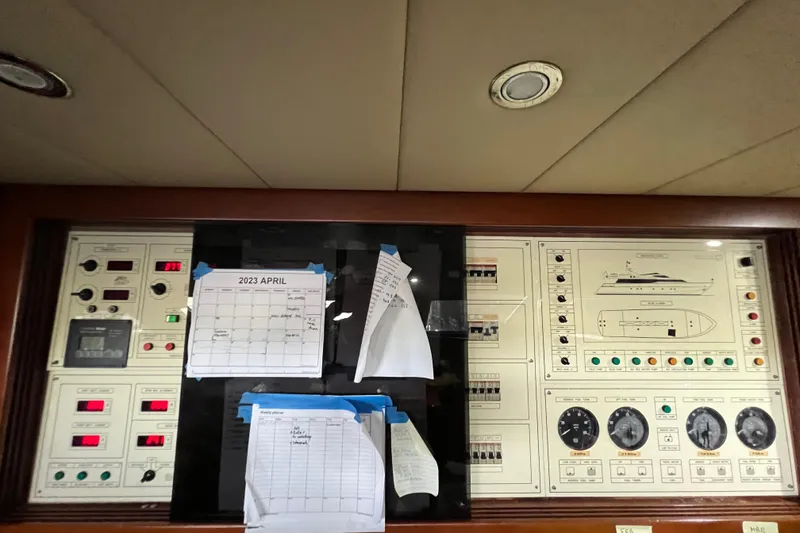 Slide: The Image of Control panel of Falcon 106 yacht, 2001 model, with April 2023 calendar and notes. - 48