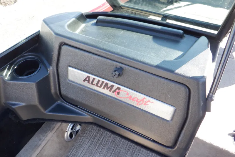 Slide: The Image of 2020 Alumacraft Competitor 165 Sport dashboard with logo and cup holder. - 21