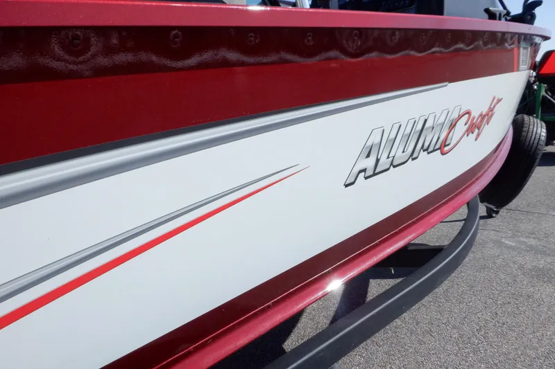 Slide: The Image of 2020 Alumacraft Competitor 165 Sport boat with red and white detailing. - 29