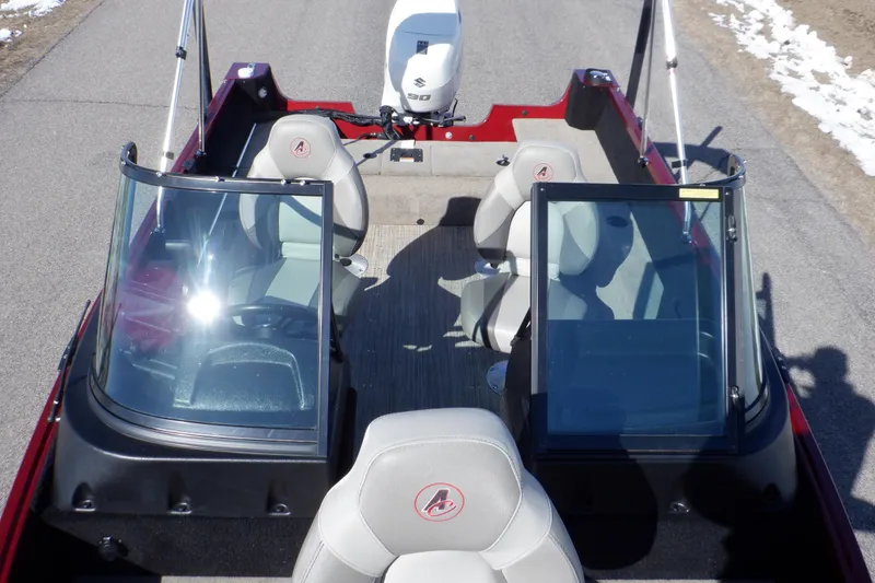 Slide: The Image of 2020 Alumacraft Competitor 165 Sport boat interior with seating and windshield. - 3