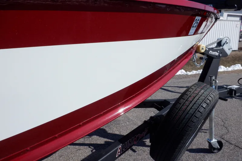 Slide: The Image of 2020 Alumacraft Competitor 165 Sport boat on trailer, red and white hull detail. - 32
