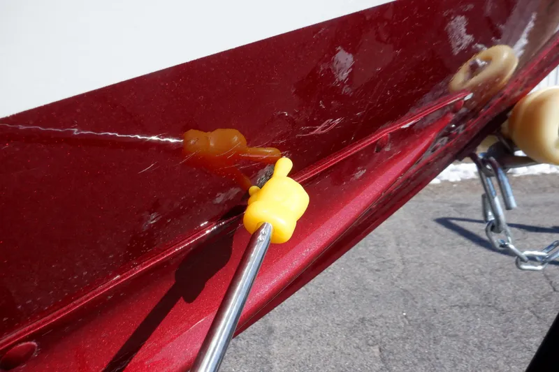 Slide: The Image of 2020 Alumacraft Competitor 165 Sport boat hull with repair tool attached. - 33