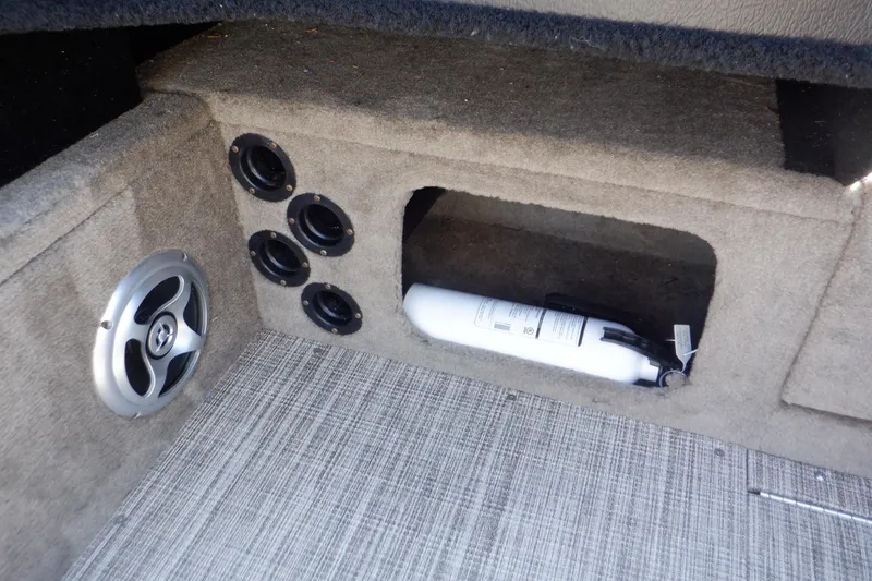 Slide: The Image of 2020 Alumacraft Competitor 165 Sport interior with speaker, vents, and fire extinguisher storage. - 42