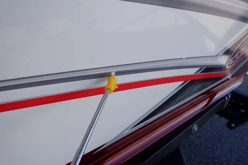 Slide: The Image of 2020 Alumacraft Competitor 165 Sport boat detail with red and silver trim. - 47