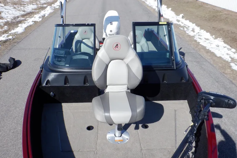 Slide: The Image of 2020 Alumacraft Competitor 165 Sport boat with dual windshields and central seating. - 7