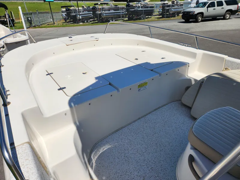 Slide: The Image of 2018 Carolina Skiff 218 DLV boat interior with seating and storage compartments. - 8