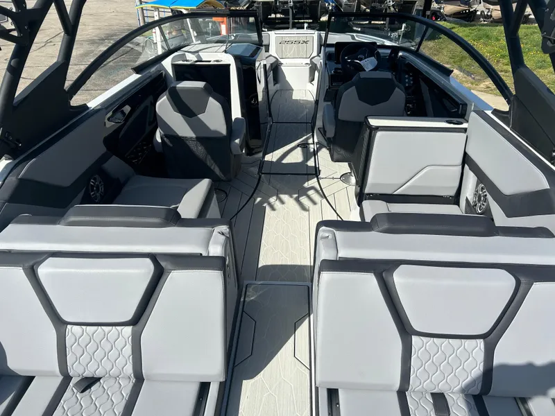 Slide: The Image of Interior view of 2025 Yamaha Boats 255XD, featuring modern seating and sleek design. - 6