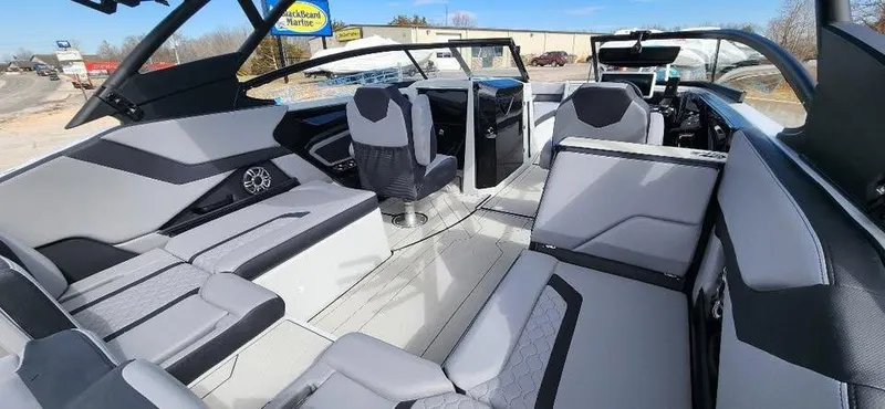 Slide: The Image of 2025 Yamaha Boats 255XD interior with sleek seating and modern design. - 9