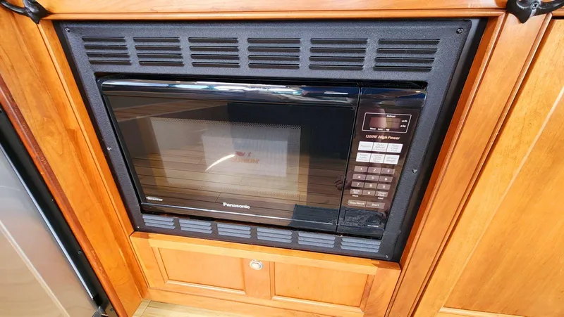 Slide: The Image of Built-in Panasonic microwave in 2002 Cruisers 5000 yacht kitchen. - 24