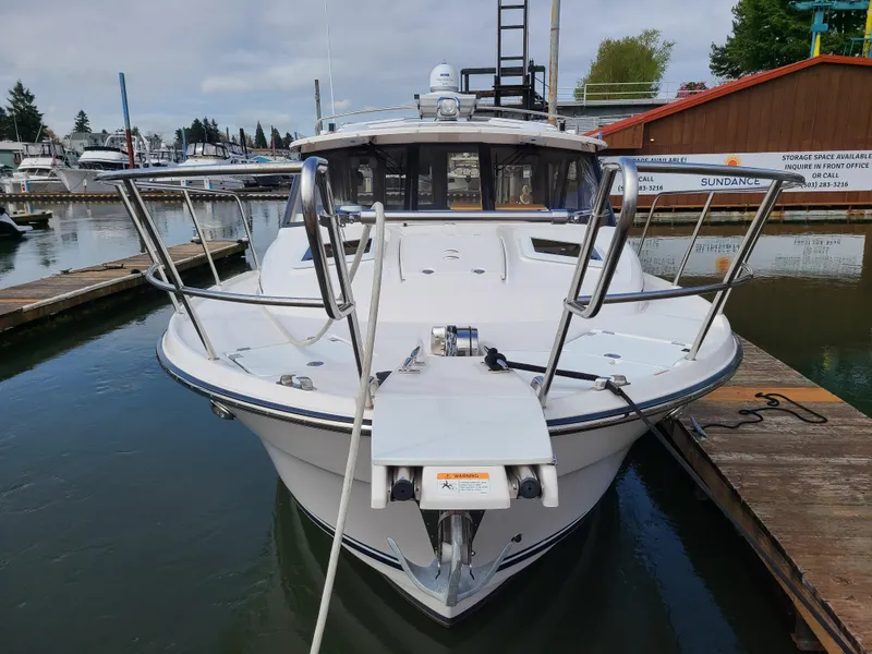 Slide: The Image of 2023 Cutwater C-30 Sedan NW Edition docked at marina, front view. - 2