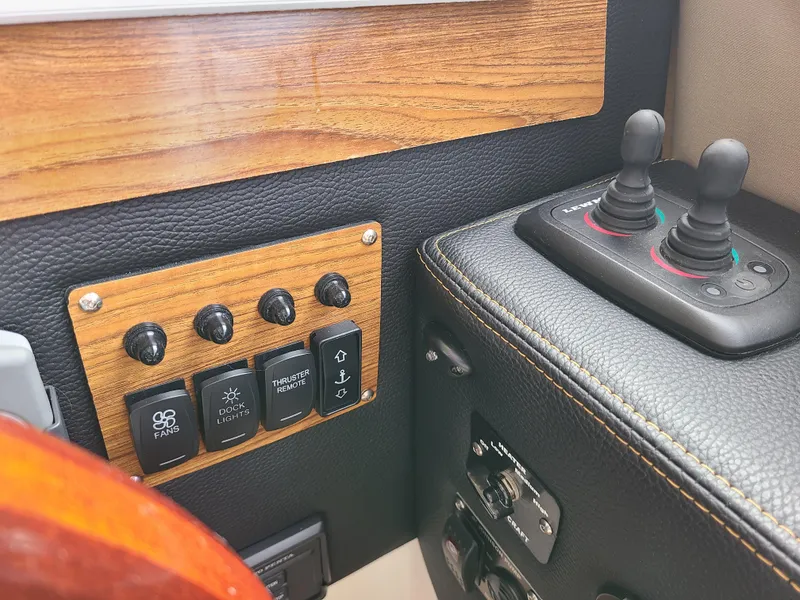 Slide: The Image of Control panel of 2023 Cutwater C-30 Sedan NW Edition with switches and joysticks. - 24