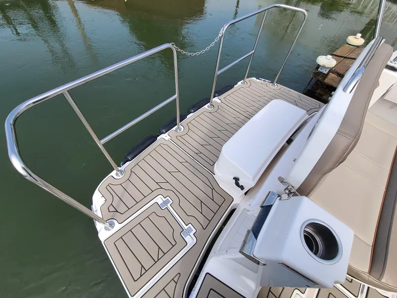 Slide: The Image of 2023 Cutwater C-30 Sedan NW Edition boat deck with railing and seating. - 8