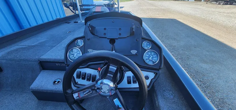Slide: The Image of 2022 Ranger RT198P boat dashboard with steering wheel and gauges. - 10