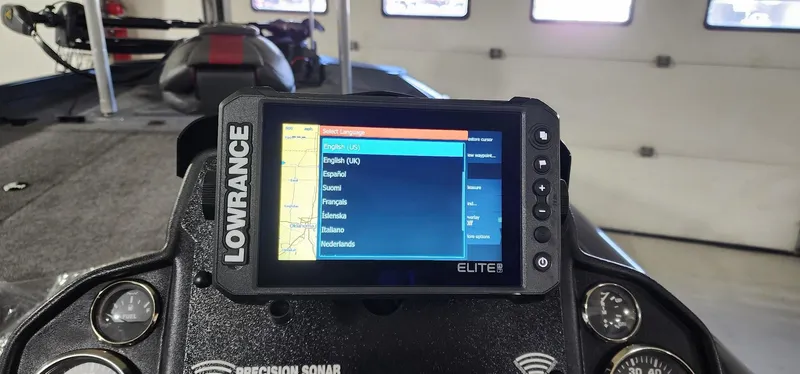 Slide: The Image of Lowrance Elite fishfinder on 2022 Ranger RT198P boat dashboard in a garage setting. - 11