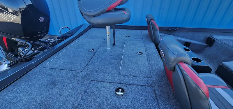 Slide: The Image of 2022 Ranger RT198P boat interior with seating and storage compartments. - 12