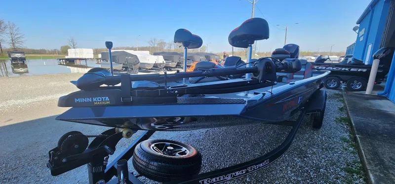 Slide: The Image of 2022 Ranger RT198P fishing boat with Minn Kota trolling motor, parked outdoors. - 3