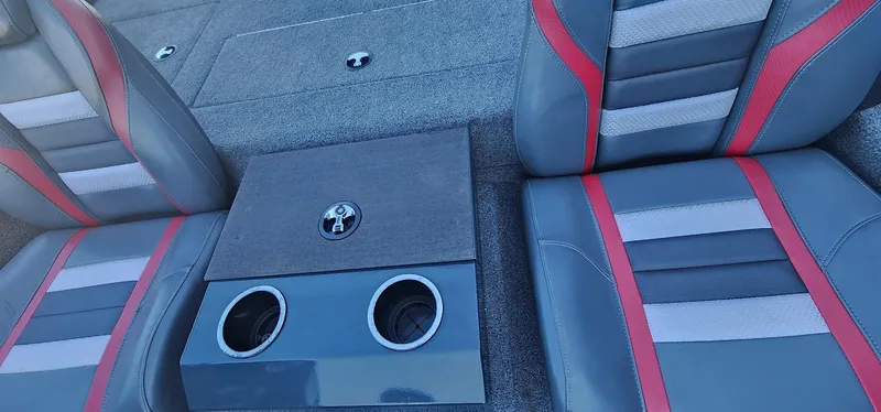 Slide: The Image of 2022 Ranger RT198P boat interior with gray and red seats, featuring dual cup holders. - 7
