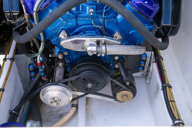 Slide: The Image of Engine of a 2000 Cigarette 38' Top Gun boat, showcasing mechanical components. - 12