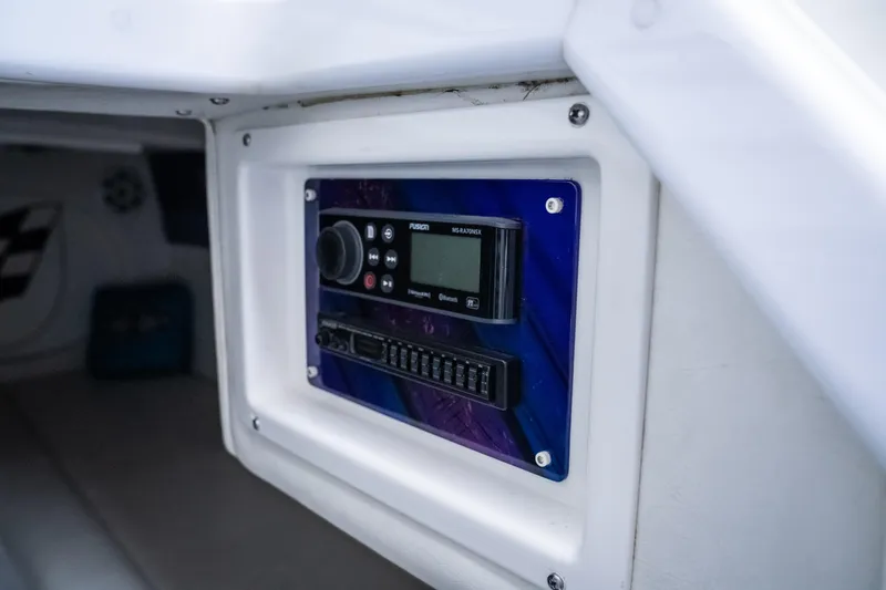 Slide: The Image of Control panel inside 2000 Cigarette 38' Top Gun boat cabin. - 25