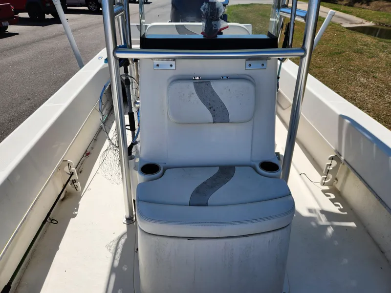 Slide: The Image of 2015 Sundance B20CCR boat interior with seating and cup holders. - 12