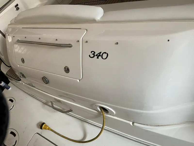 Slide: The Image of 2000 Sea Ray 340 Sundancer boat deck with power cable connection. - 11