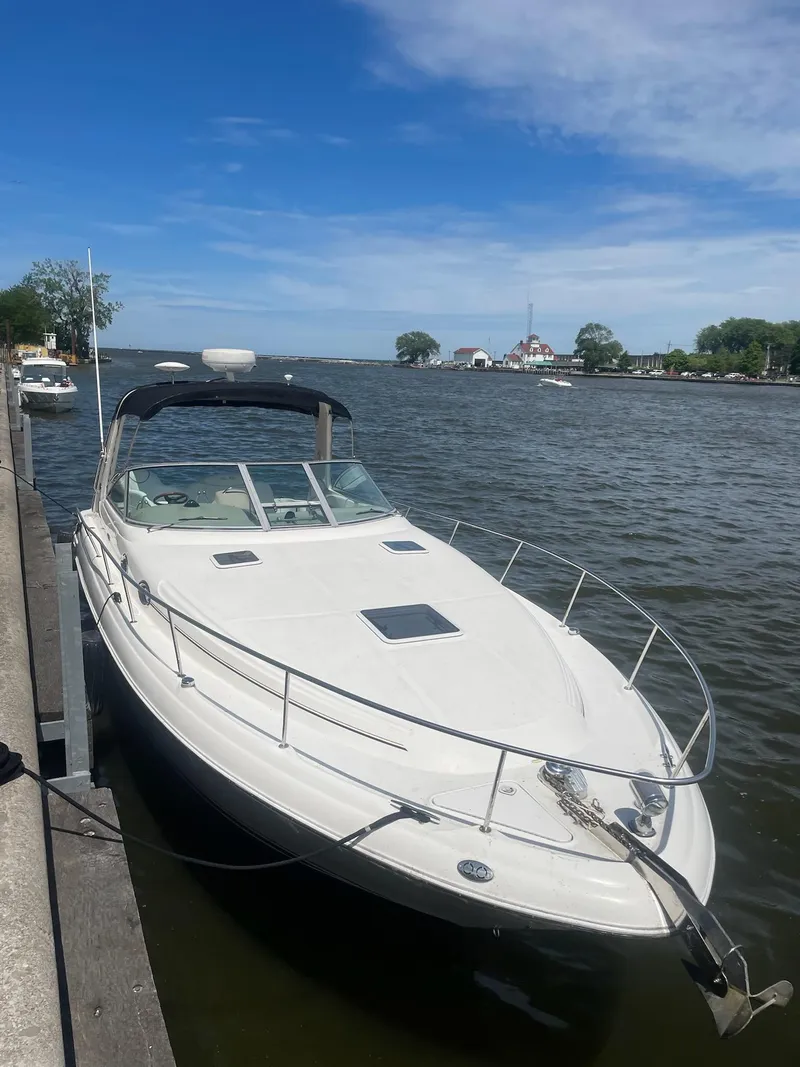 Slide: The Image of 2000 Sea Ray 340 Sundancer docked by a scenic waterfront. - 5