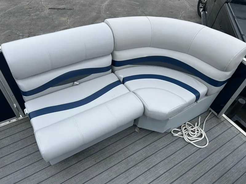 Slide: The Image of White and blue seating on 1999 Sylvan 20 Cruise boat deck. - 4